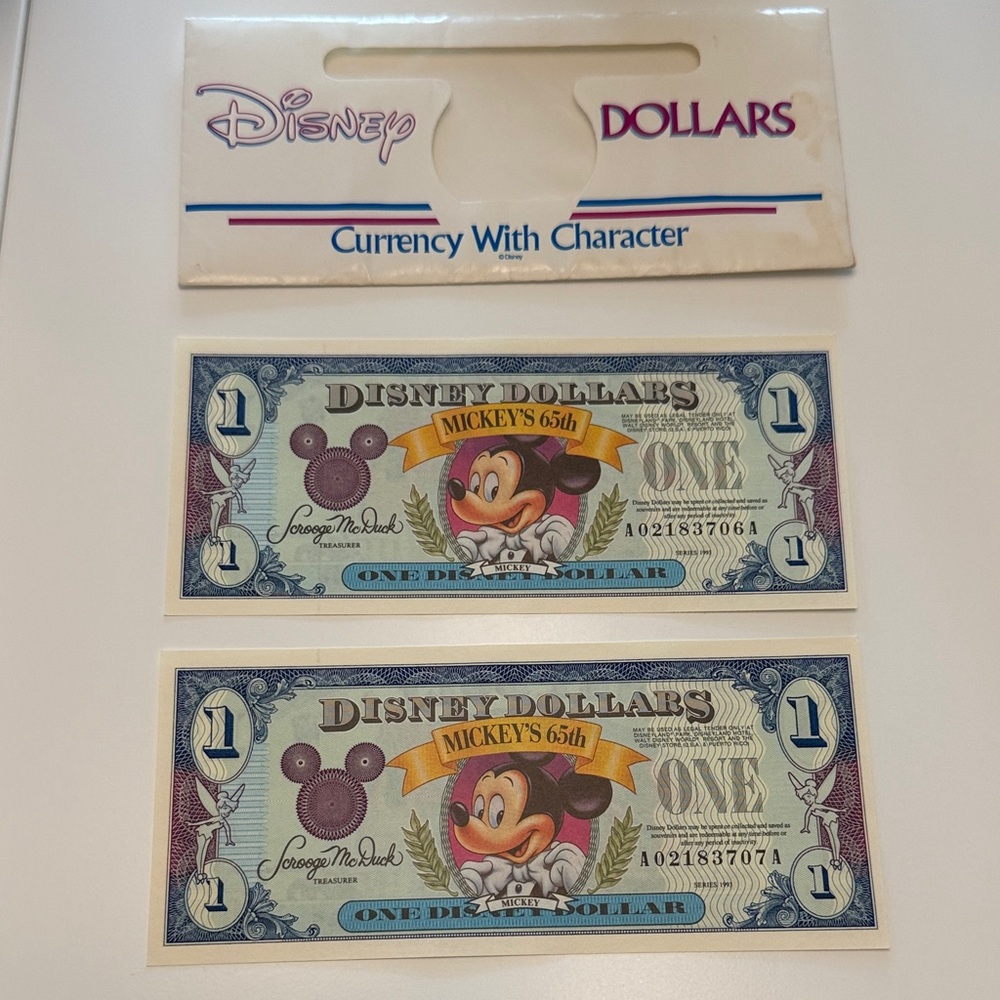 1993 A series uncirculated Disney Dollar for Mickey’s 65th